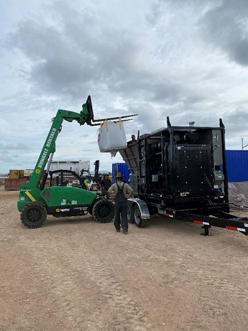 telehandler forklift into the blower’s hopper